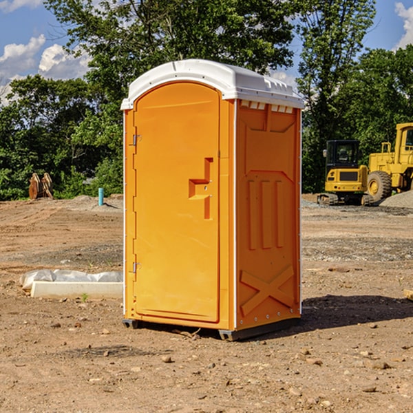 what is the cost difference between standard and deluxe porta potty rentals in Guernsey IA